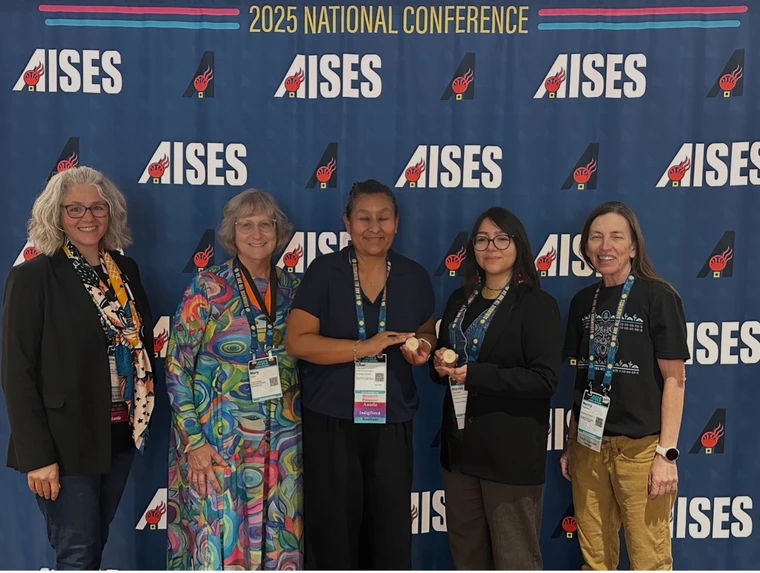 U of A Haury Program staff and DAF Board member, Mary Grier, with LaCher Pacheco and Nieves Vazquez, 2025 Haury Indigenous Resilience Graduate Research awardees, after both students won in their categories of presentations.
