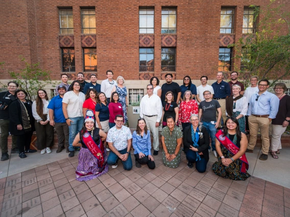 Attendees of the Women's Plaza event posing for a group photo