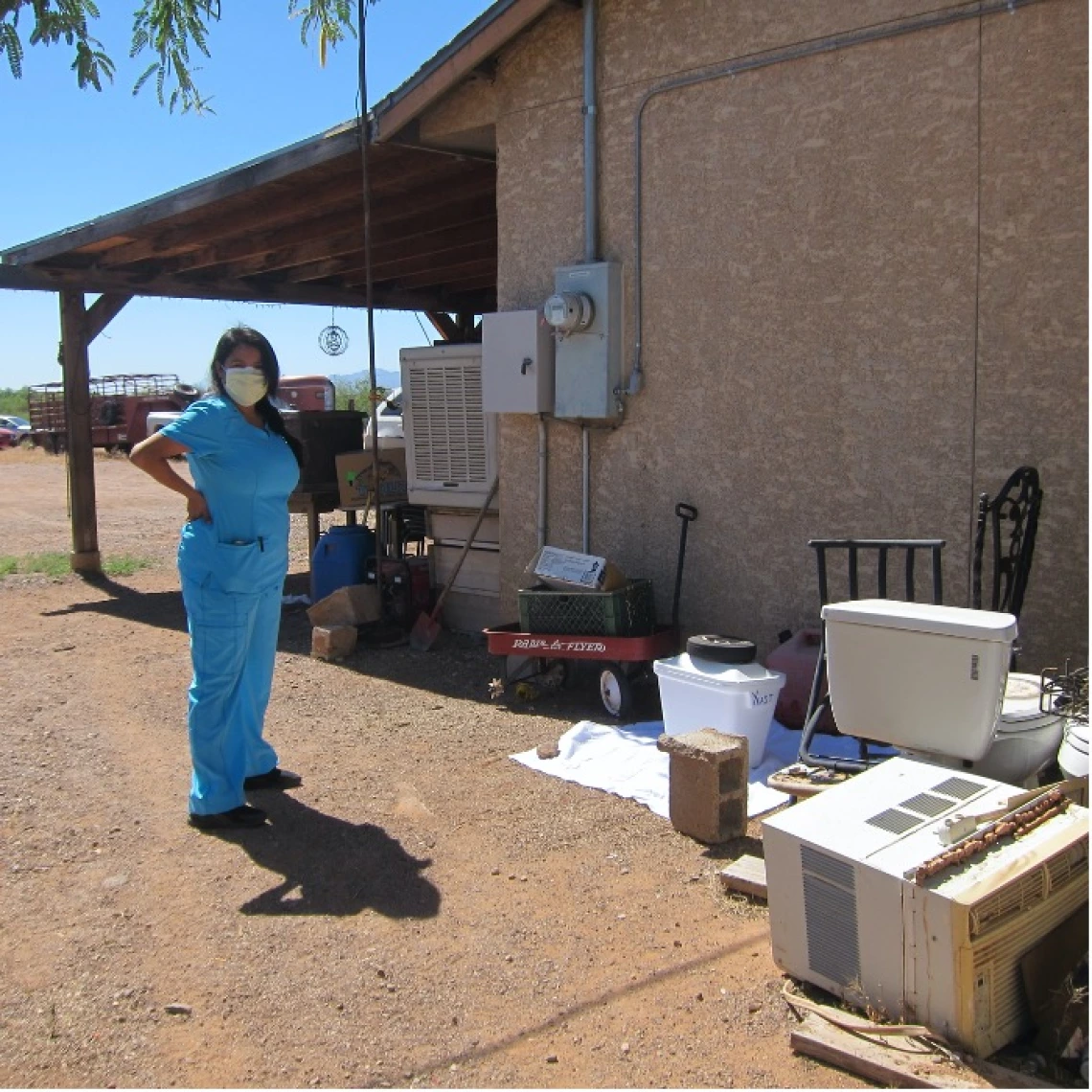 Woman wearing a mask looking at the camera